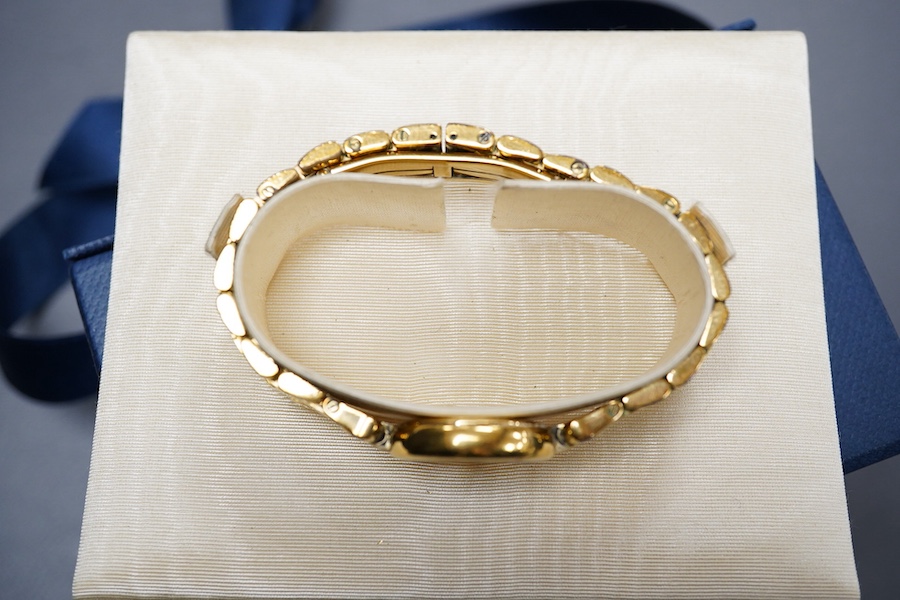 A lady's 2002 gilt steel Raymond Weil quartz wrist watch, with mother of pearl dial and simulated diamond dot numerals, with box and papers.